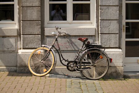 Women's bicycle dutch pavement photo