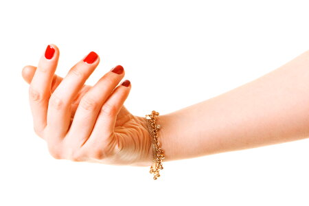 Woman Hand with Gold Bracelet photo