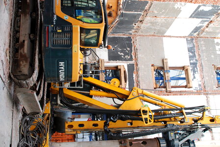 Digger inside a house photo