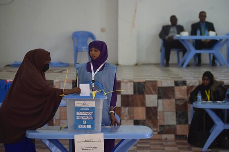 Polling station ballot box women photo