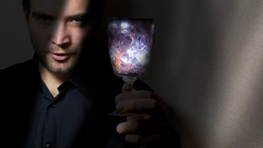 man holding wine glass photo