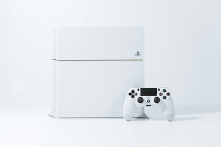 White PS4 Videogame Console and Game Controller photo