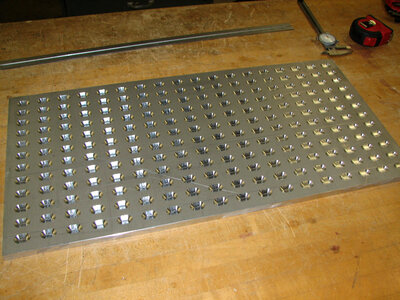 Metal plate used to hold mussels in place in the laser engraver