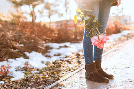 Young girl with roses on the street