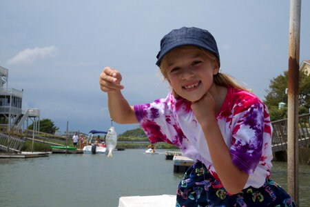 Girl holding little fish