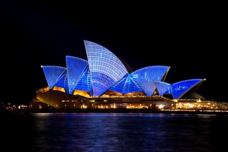 The Sydney Opera House is being illuminated during night time