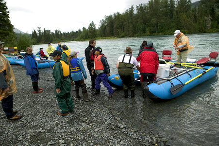 Group of people venturing out by pontoon boat photo