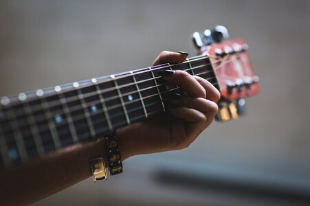 Close up of woman playing guitar photo