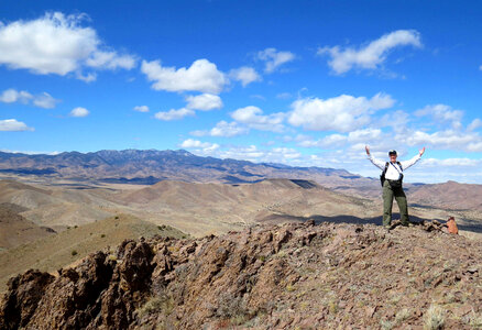 Employee with open arms in the landscape