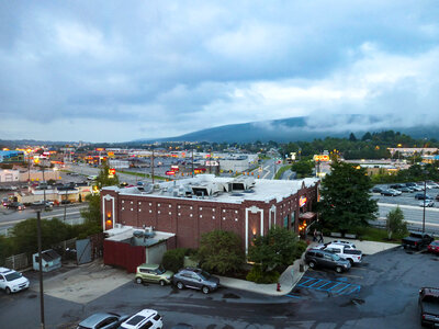 Buildings and Mountains Over Highway photo