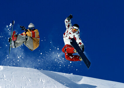 Young snowboarder in deep powder photo