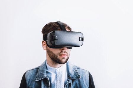 Man wearing virtual reality goggles. photo