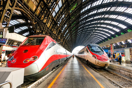 Two Fast Trains in a Train Station photo