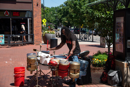 Man playing drums on the street photo
