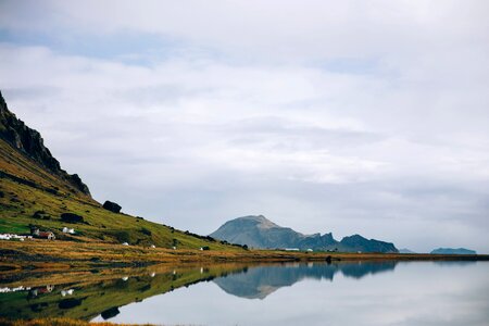 Glassy Iceland Lake Water Reflects Hillside photo