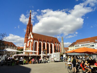 Tourists sitting in front of Gothic style Chapel of St. Mary photo