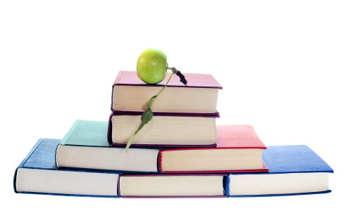 Green apple on books photo