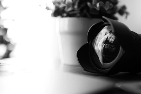 Black and White. Detail of lens with reflections in the glass photo