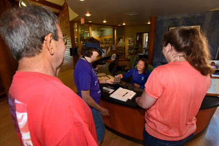 FWS Staff greets visitors at visitor center desk-8 photo