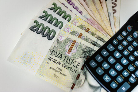 Counting and paying bills with Czech money photo