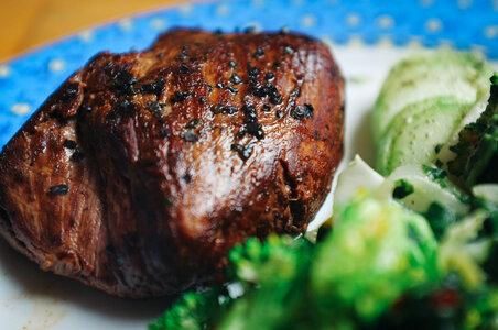 Beef steak with black salt close up photo