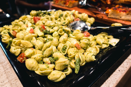 Pasta with green beans and tomatoes photo