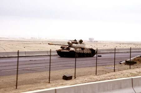 Iraqi Type 69 tank on the road into Kuwait City during the Gulf War photo