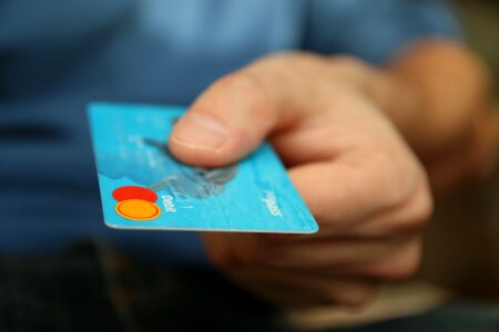 closeup of credit card holded by hand. photo