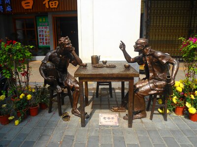 Statues table chairs
