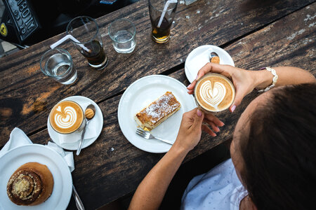 Writing on a typewriter with coffee and biscuit photo