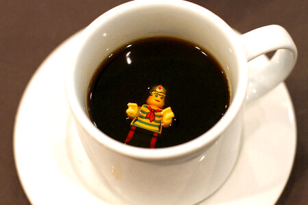 Legoman drowning in a cup of coffee photo
