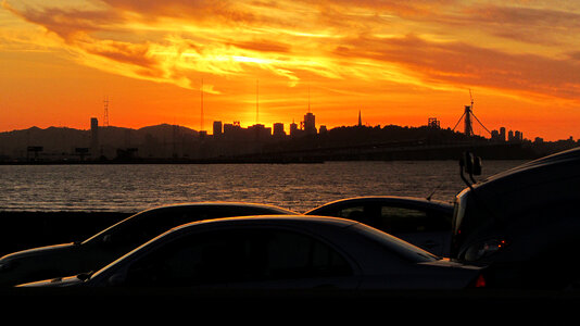 Sunset over the skyline and cars in San Francisco, California photo
