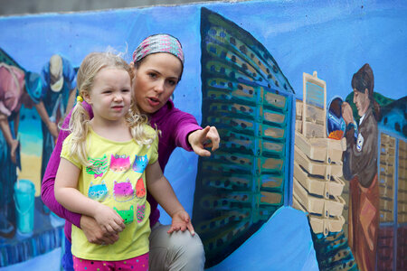 Mother and daughter enjoying an exhibit at the hatchery