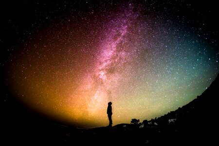 Man staring at starry Sky photo