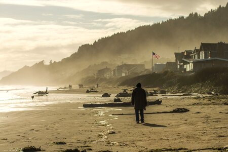 Man mountain ocean photo