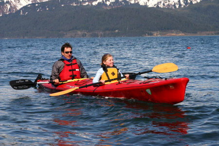 Man and girl in kayak photo