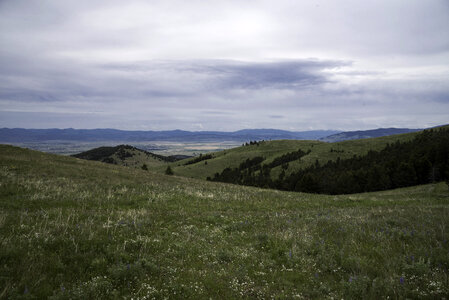Overlapping hill landscape with mountains in the background in Helena photo