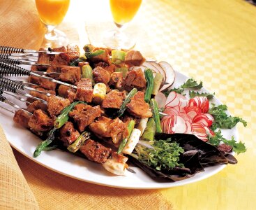 Japanese grilled food on skewers photo