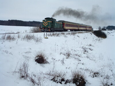 train on snow covered tracks photo