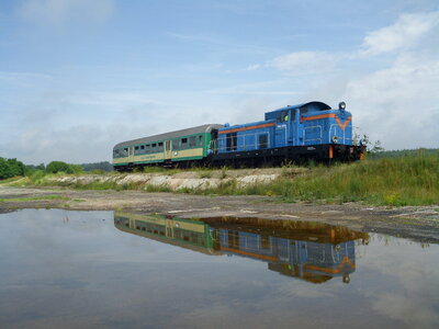 an old locomotive near the lake photo