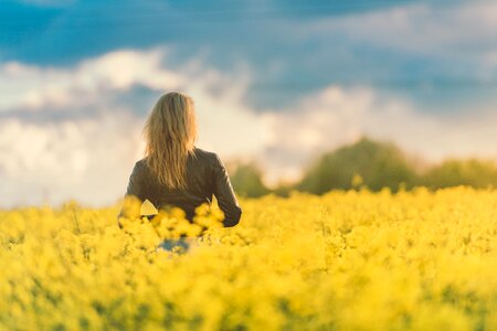 Woman in Yellow Field at Sunset photo