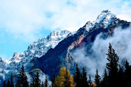 Fog on the high Mountains with trees in Jasper National Park, Alberta, Canada photo