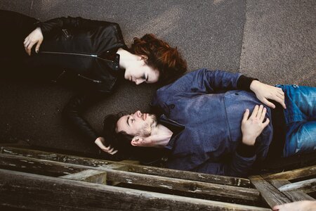 Man and Woman Together Lying on a Floor photo