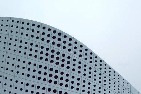Abstract Facade of Modern Building with Circle Hole photo