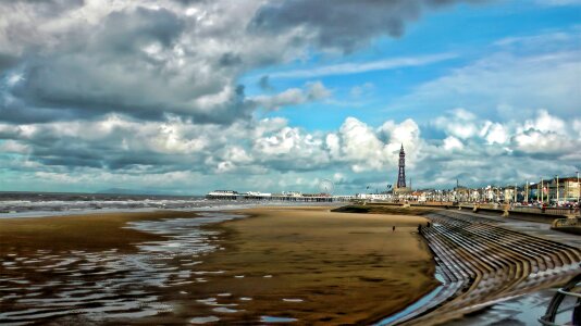 Beach clouds sand photo