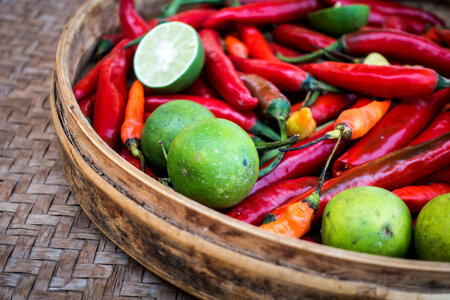 Limes and chili peppers photo