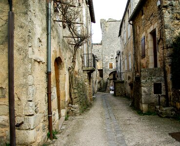 Medieval village narrow street pavers photo