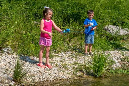 Little girl and boy fishing