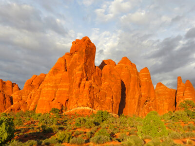Rock and Hill Formations under clouds at Arches National Park photo