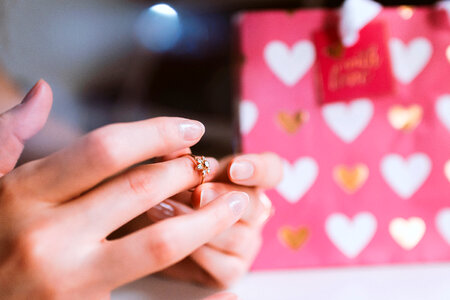 Valentine’s Day, Hands of girl with a ring of love photo